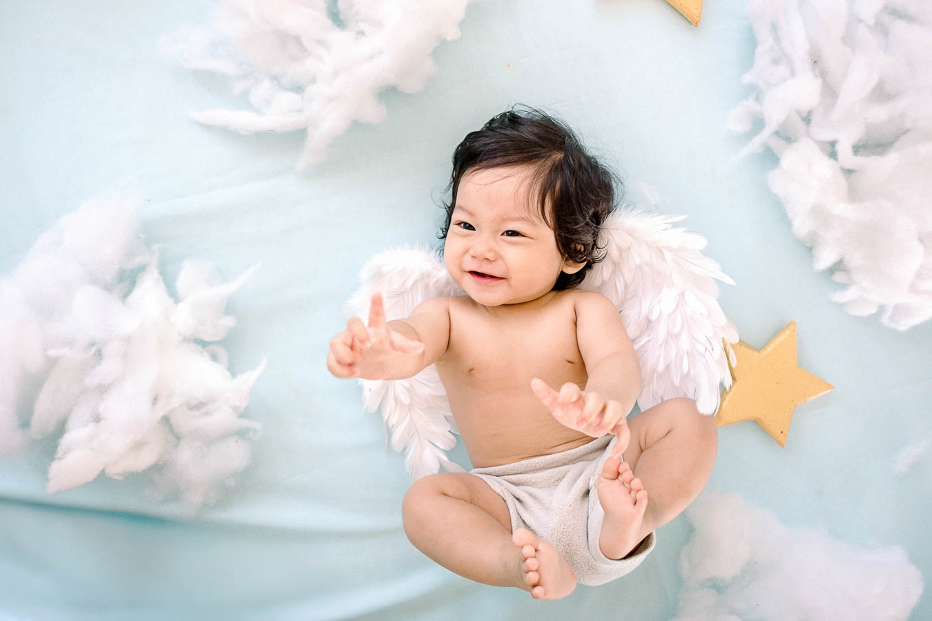 Baby Arka portrait with angel wings in Bali photography studio