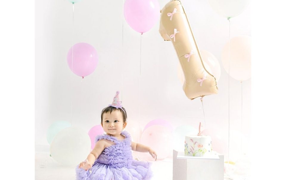 Cake smash photoshoot of a baby girl celebrating her first birthday in Bali