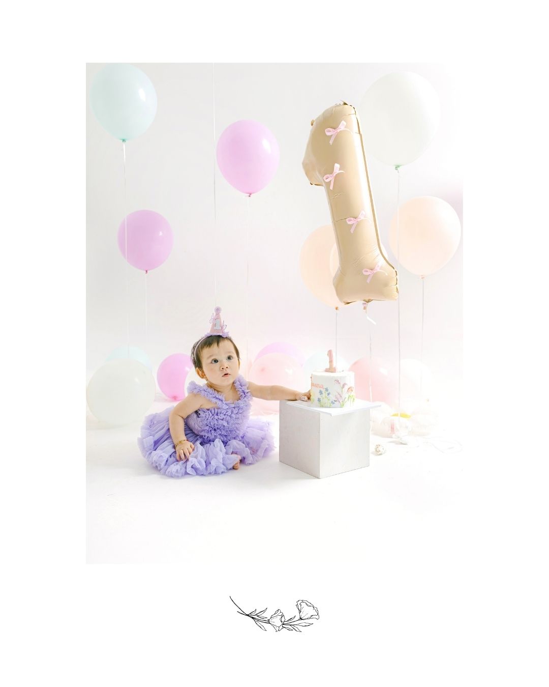 Elegant smash cake setup for a baby’s first birthday photographed by a bali smash cake photographer. 