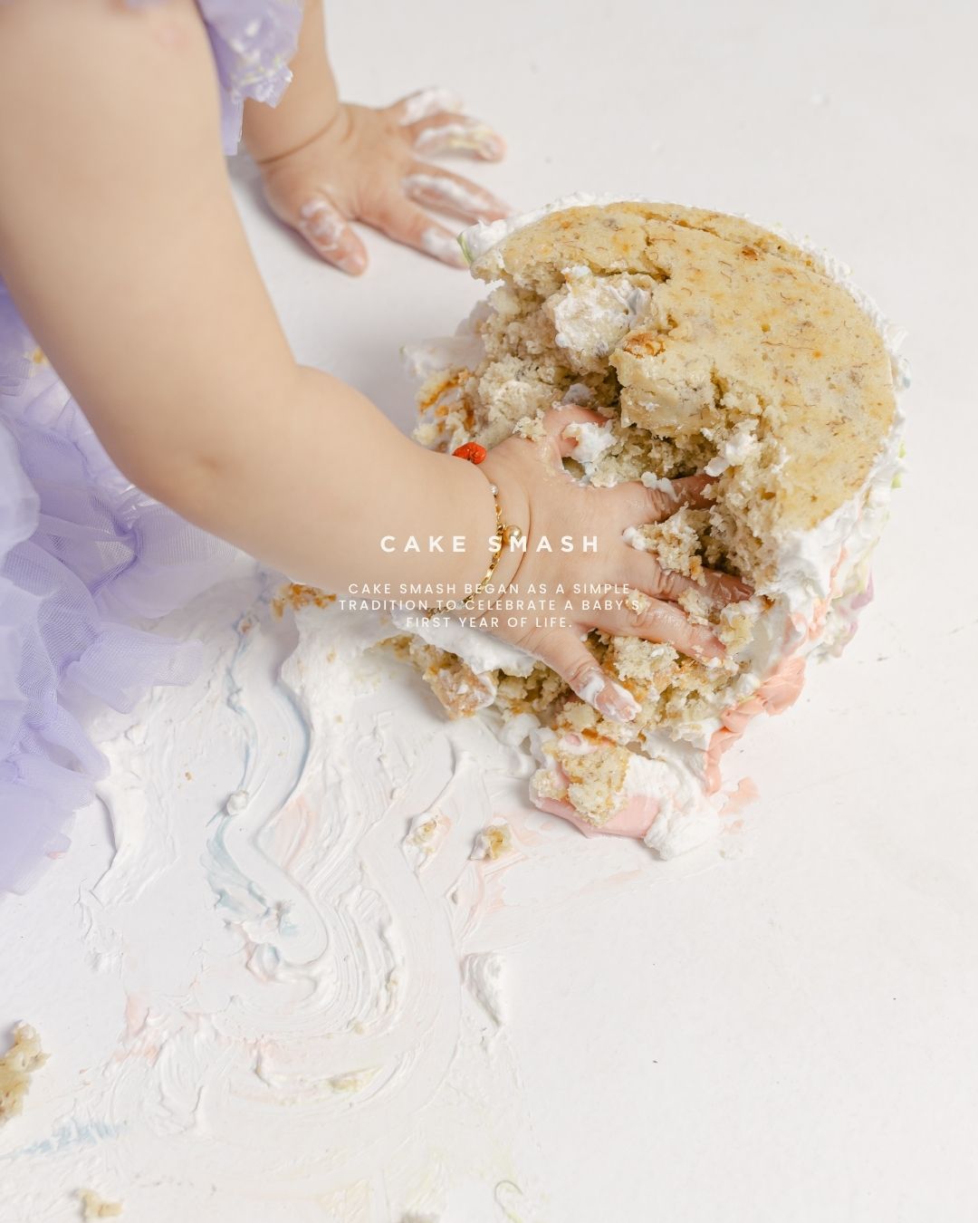 Close-up details of a baby smashing cake during a first birthday session in Bali by a smash cake photographer. 