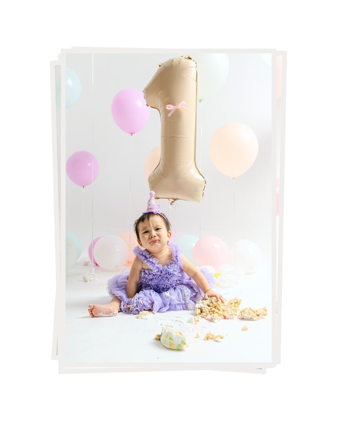 Playful baby moments during a smash cake photoshoot in Bali photographed by a bali smash cake photographer. 